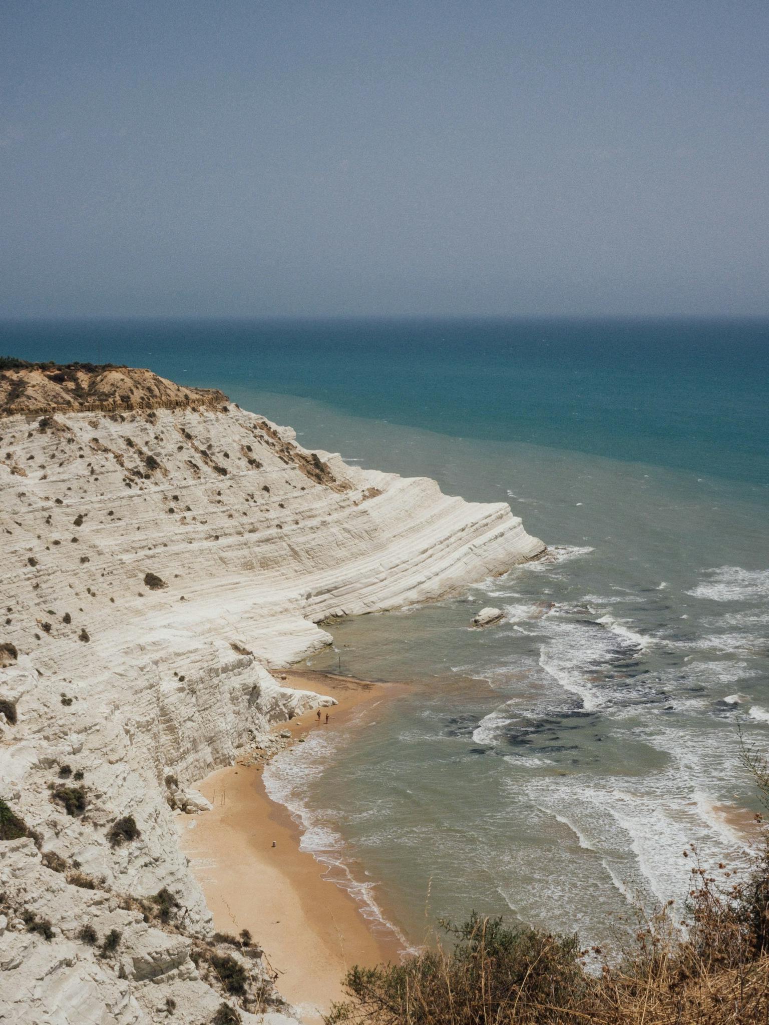 Breathtaking aerial view of Scala dei Turchi with white cliffs and turquoise sea in Sicily.